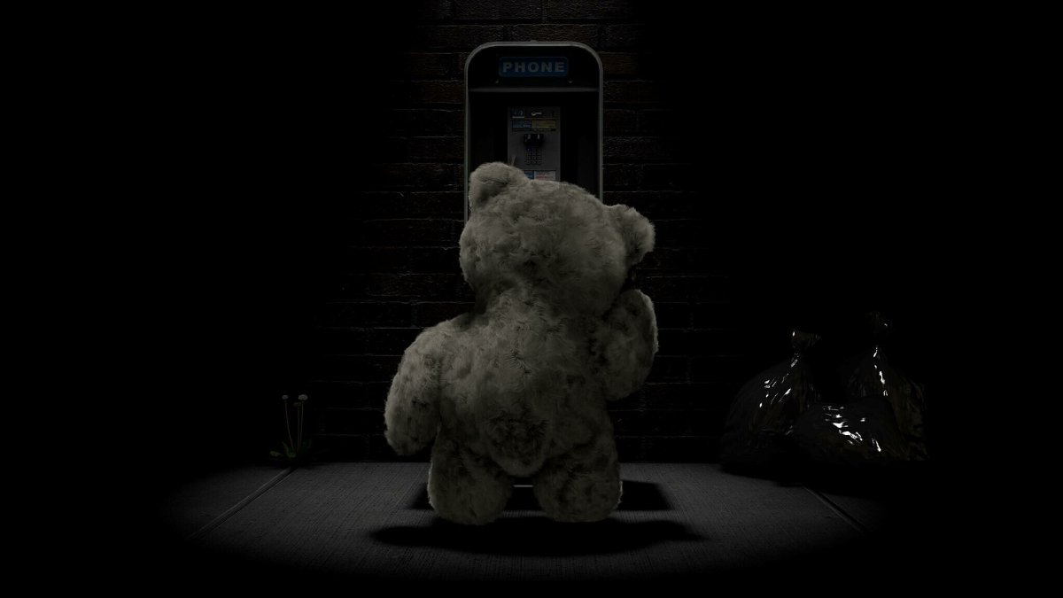 Плюшевый мишка на черном фоне